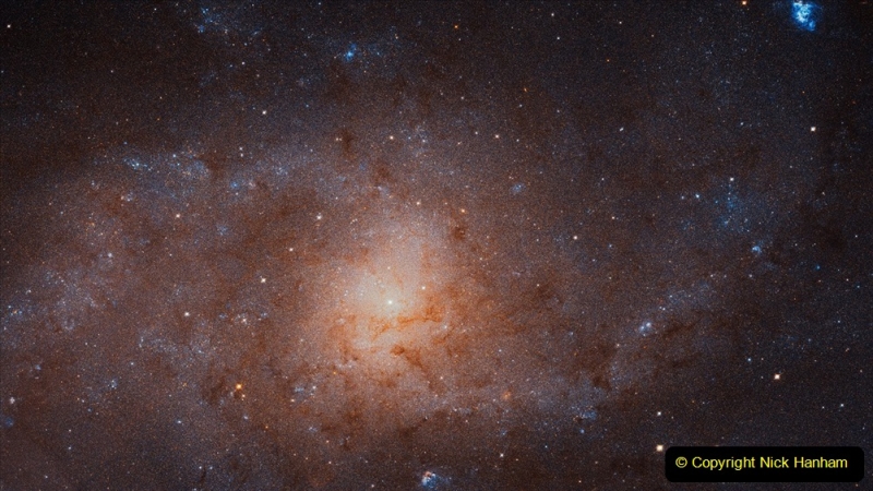 This gigantic image of the Triangulum Galaxy — also known as Messier 33 — is a composite of about 54 different pointings with Hubble’s Advanced Camera for Surveys. With a staggering size of 34 372 times 19 345 pixels, it is the second-largest image ever released by Hubble. It is only dwarfed by the image of the Andromeda Galaxy, released in 2015. The mosaic of the Triangulum Galaxy showcases the central region of the galaxy and its inner spiral arms. Millions of stars, hundreds of star clusters and bright nebulae are visible. This image is too large to be easily displayed at full resolution and is best appreciated using the zoom tool.