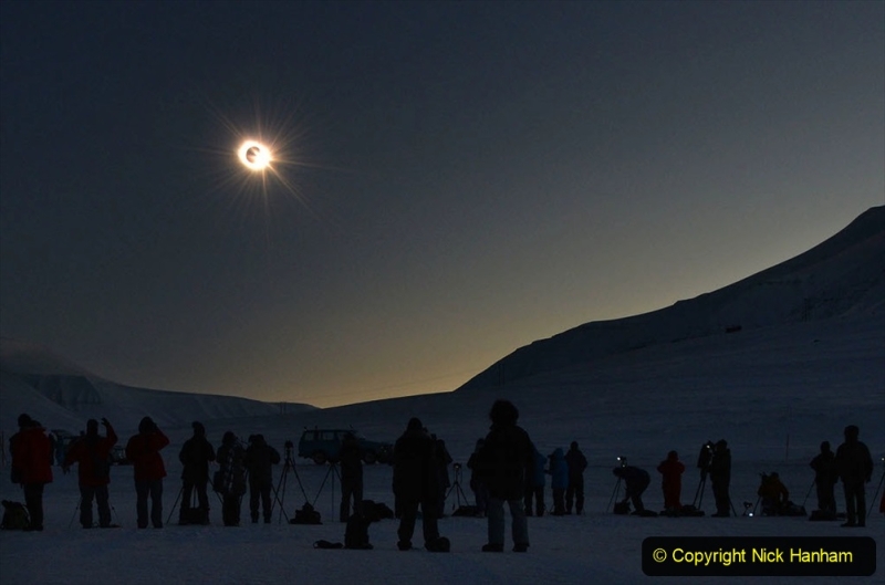 People see the "third contact" as the sun begins to appear from behind the moon during a total solar eclipse as viewed from Longyearbyen, Svalbard, an archipeligo administered by Norway March 20, 2015. Thousands gathering here as the only land the total eclipse will be seen from is on Svalbard and the Faoroe Islands off Iceland. AFP PHOTO/STAN HONDA