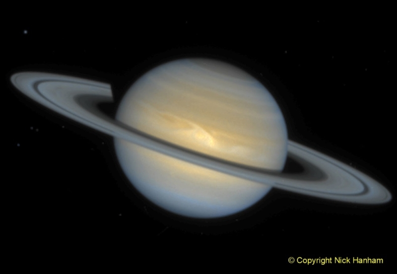 This Hubble Space Telescope image of the ringed planet Saturn shows a rare storm that appears as a white arrowhead-shaped feature near the planet's equator. The storm is generated by an upwelling of warmer air, similar to a terrestrial thunderhead. The east-west extent of this storm is equal to the diameter of the Earth (about 12700 kilometres). Hubble provides new details about the effects of Saturn's prevailing winds on the storm. The new image shows that the storm's motion and size have changed little since its discovery in September, 1994.