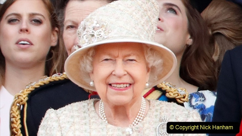 LONDON, UNITED KINGDOM - JUNE 08: (EMBARGOED FOR PUBLICATION IN UK NEWSPAPERS UNTIL 24 HOURS AFTER CREATE DATE AND TIME) Queen Elizabeth II watches a flypast from the balcony of Buckingham Palace during Trooping The Colour, the Queen's annual birthday parade, on June 8, 2019 in London, England. The annual ceremony involving over 1400 guardsmen and cavalry, is believed to have first been performed during the reign of King Charles II. The parade marks the official birthday of the Sovereign, although the Queen's actual birthday is on April 21st. (Photo by Max Mumby/Indigo/Getty Images)