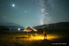 XINJIANG, CHINA - AUGUST 13: A man watches the Perseid meteor shower on the Pamir Plateau on August 13, 2021 in Xinjiang Uygur Autonomous Region of China. (Photo by VCG/VCG via Getty Images)