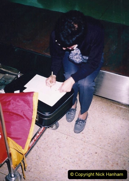 China 1993 April. (20) Beijing Airport. Filling out entry forms. 019