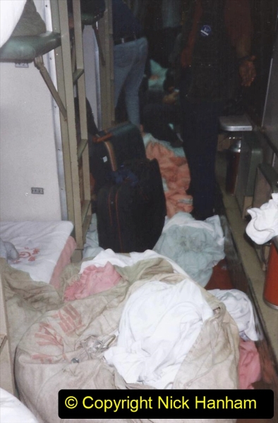 China 1999 October Number 2. (148) Our coach Dragon Lady clears our bedding very early much to our consternation.