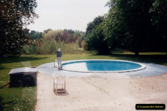 1995 France May - June. (14) At Villechaise for our stay in france. Our Host cleans the pool.14