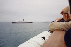 1994 France. (156) As we leave Cherbourg we pass the QE2 on a Normandy Landings Cruise. 161