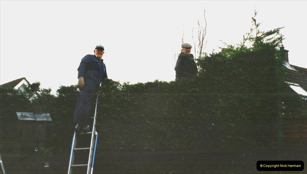 2002-Miscellaneous.-291-Your-Host-and-friend-Tony-lowering-my-house-hedge-height.-291