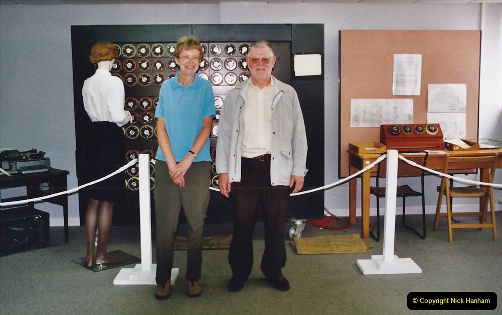 2002-Miscellaneous.-80-Bletchley-Park-Near-Milton-Keynes-Bedfordshire.-Your-Host-with-friend-stand-in-front-of-Alan-Turings-Bomb.080