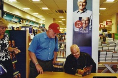 2002-Miscellaneous.-212-Murray-Walker-signing-his-book-for-your-Host.-212