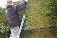 2002-Miscellaneous.-293-Your-Host-and-friend-Tony-lowering-my-house-hedge-height.-293